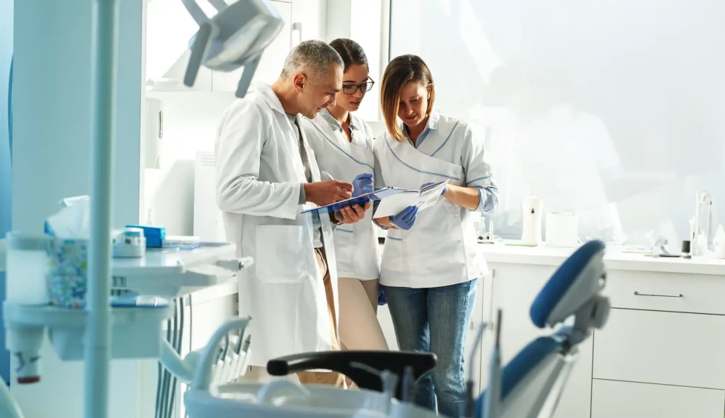 Dental hygienist shortage in the U.S. – dental office team working with patients 2025