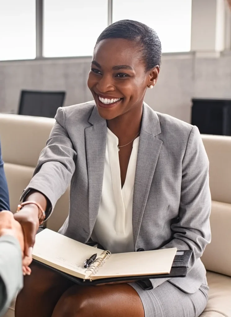 year-end healthcare leadership career moves – smiling healthcare executive greeting a colleague during a professional meeting