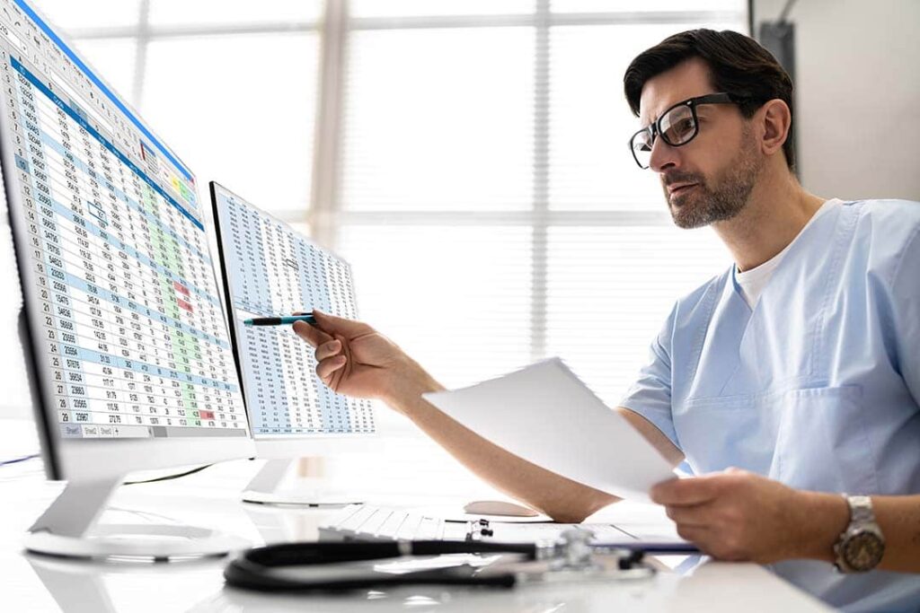 K-economy healthcare trends reflected in healthcare professional reviewing digital workforce and employment data in office setting
