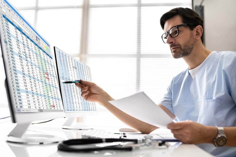 K-economy healthcare trends reflected in healthcare professional reviewing digital workforce and employment data in office setting