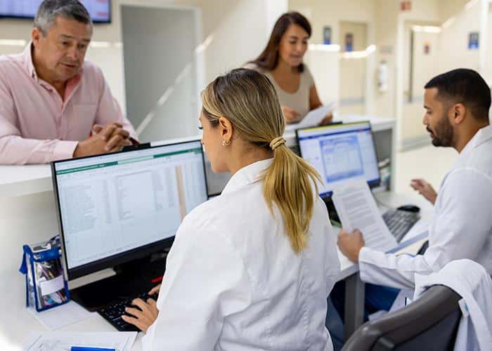 Healthcare administrative staffing professionals coordinating patient scheduling and front office operations at a medical practice.